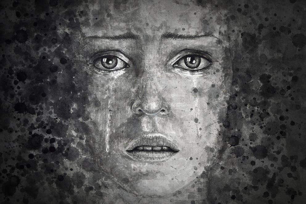 A woman with depression is crying thinking about women
