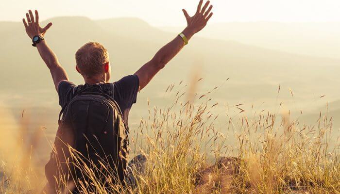 man sat in field