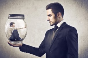 Toxic boss looking at employee