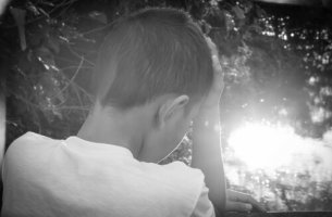 boy with head in hands