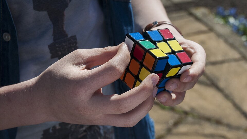 person solving Rubik's cube