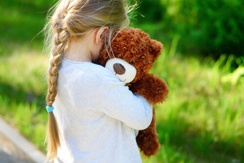 child with teddy