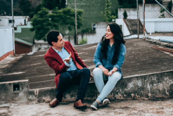 a couple talking on the roof