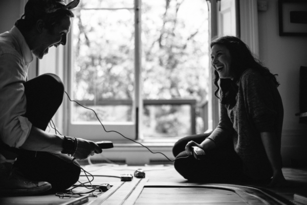 a happy couple working at home