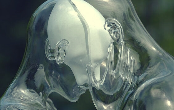 A couple made out of transparent glass.