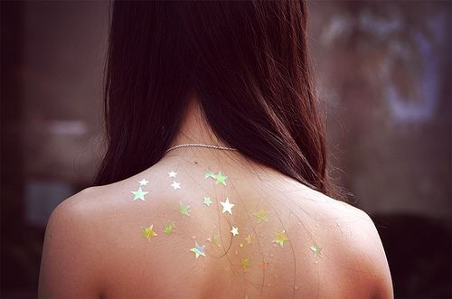 Girl with stars on her back.