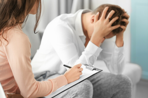 A therapist with her upset patient.