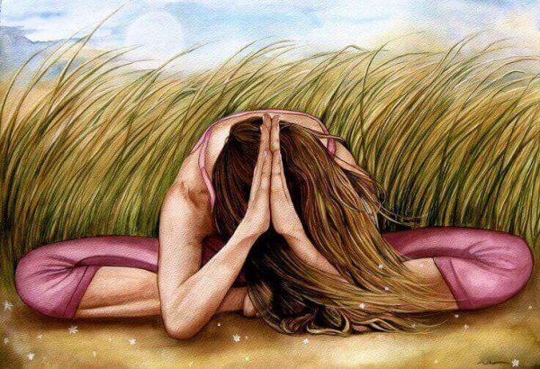 A woman meditating in a field, developing her intuition.