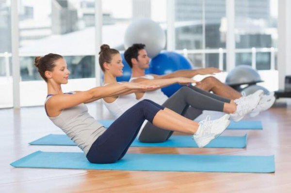 In a gym doing pilates.