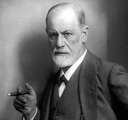 A portrait of Sigmund Freud smoking a cigar.