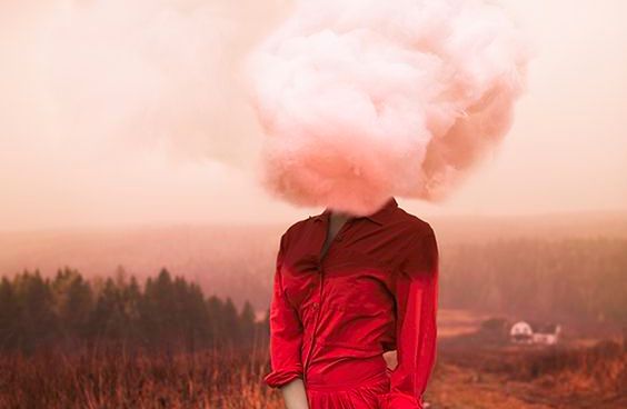 Woman in red with cloud for a head.