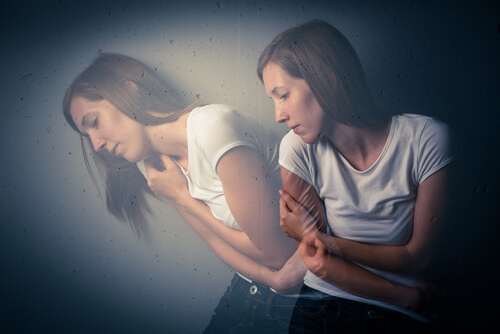 scared woman is holding self.