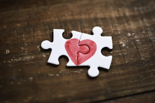 Two puzzle pieces which together make hearts