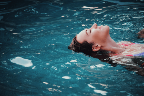 Personality and emotions: a woman floating in the water.