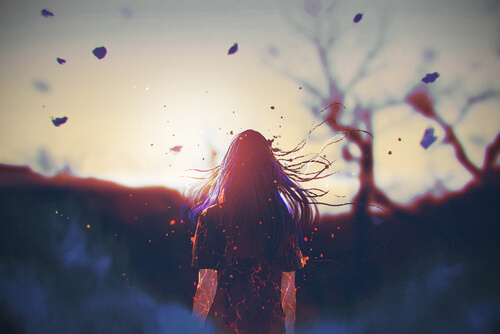 A woman walking in the sunset.