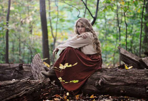 Woman sitting in wood