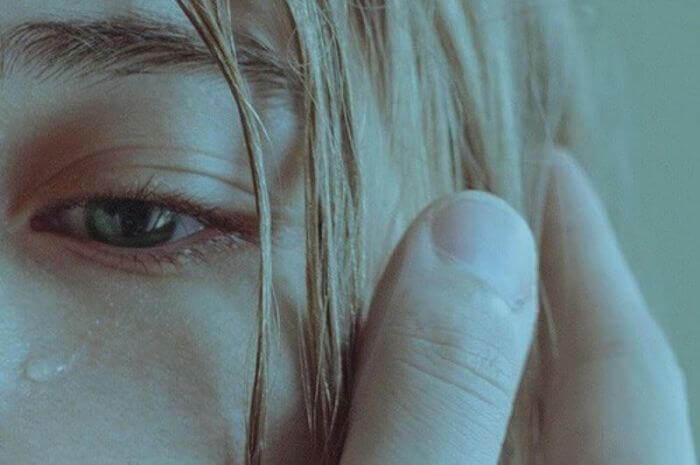Woman is suffering from abuse and crying.