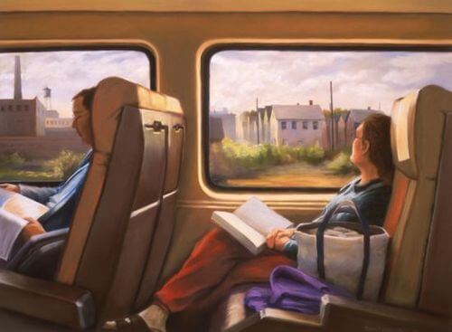 Woman with book gazing out a train window.