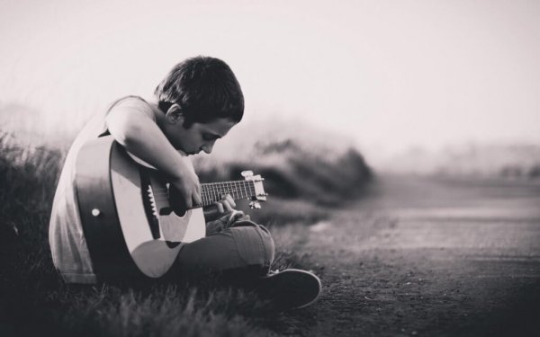 Grief in children, boy playing guitar