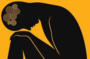 person bent over with anxiety