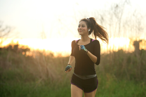 A girl jogging while listening to music.