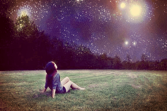 A woman watching the starry night and discovering her inner light.
