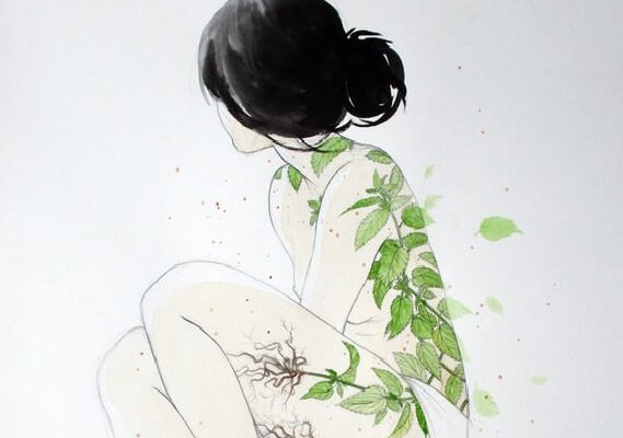 Girl with tree leaves on her skin.