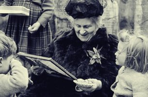 María Montessori as an elderly lady surrounded by children giving quotes