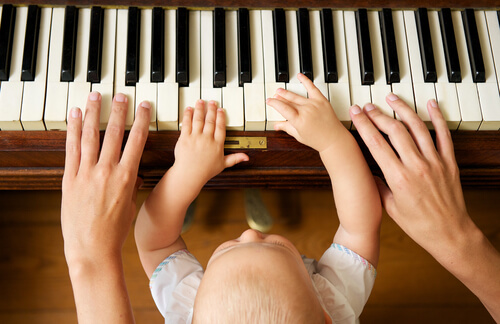 Does music make children smarter? A baby at the piano.