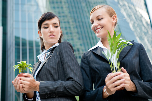 girls holding plants
