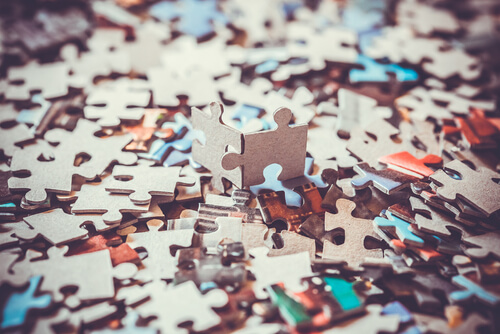 Two puzzle pieces fit together.