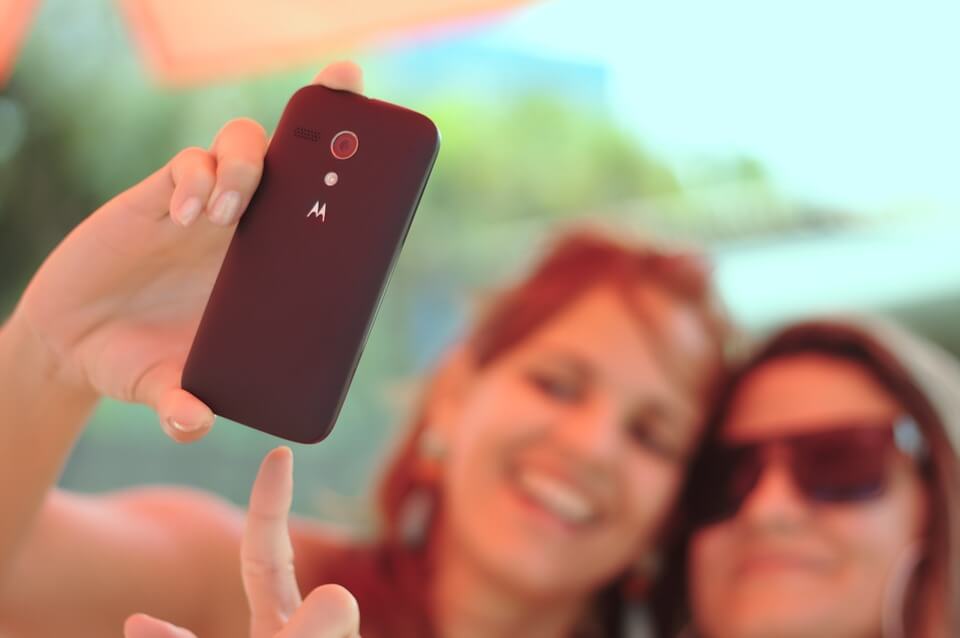 Two girl are taking a selfie.