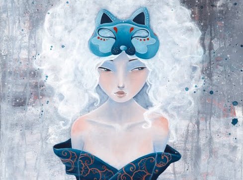 A woman wearing a blue wolf mask.