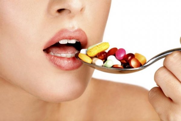 Eating pills on a spoon.