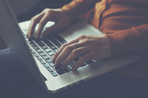 A freelancer working on his laptop.