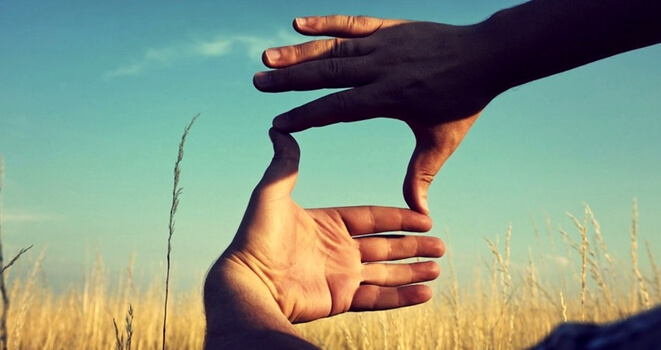 Making a frame with hands.