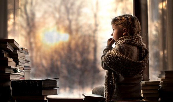 Boy looking out of window