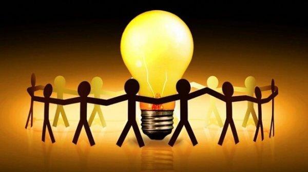 Figures surrounding a light bulb