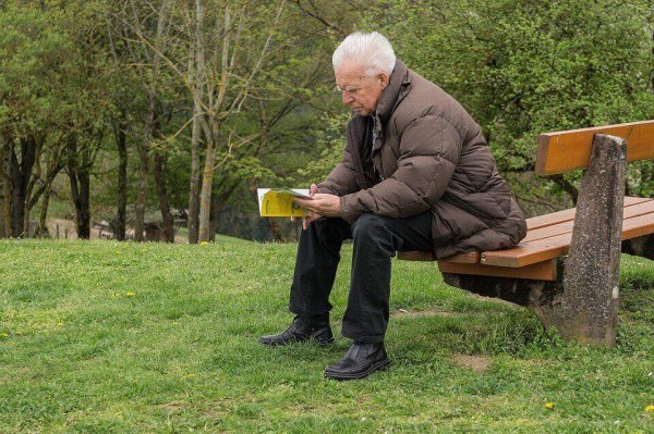 Man reading a book representing collective memory