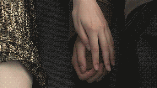 Gif of a couple holding hands.