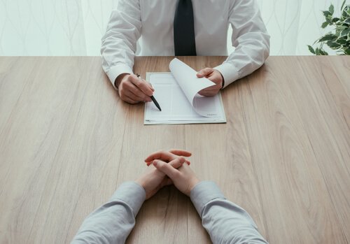 At a job interview with your resume.