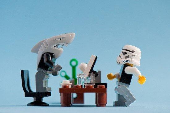 A shark and a lego man at work.