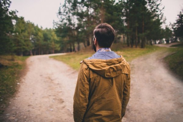 Man facing two roads