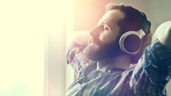 A man is listening to relaxing music.