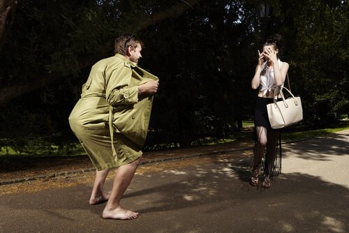 man flashing a surprised woman