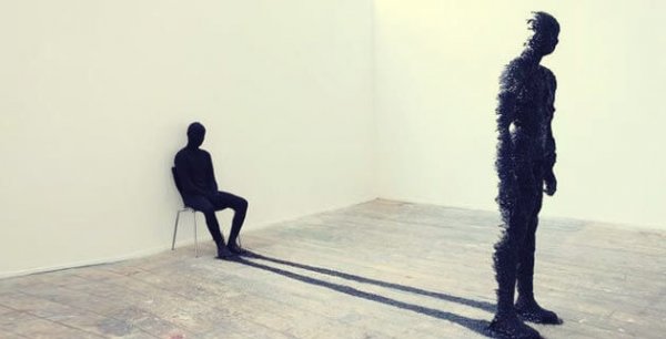 Person looking at their shadow archetype