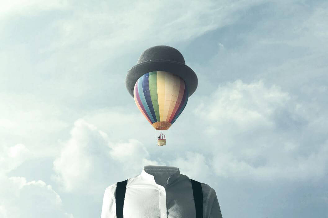 A man with a hot air balloon for a head.