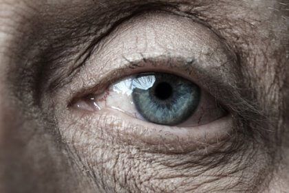 An older adult close-up of a blue eye
