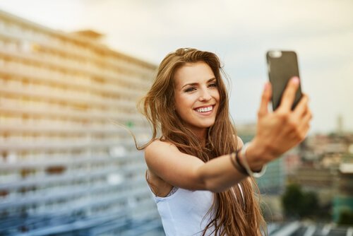 A woman taking a selfie.