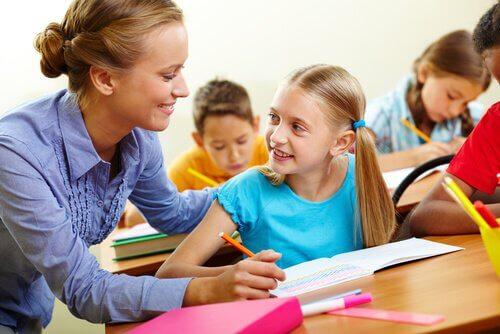 A teacher helping a student.